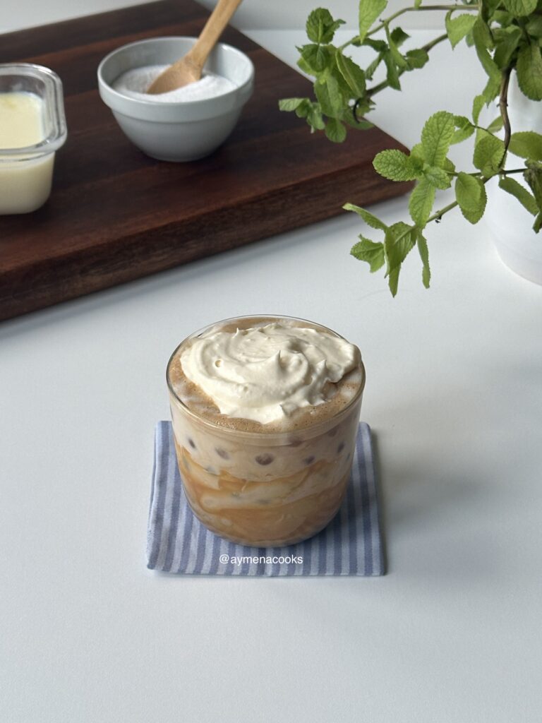 custard cream spooned on top of an iced creme brulee latte