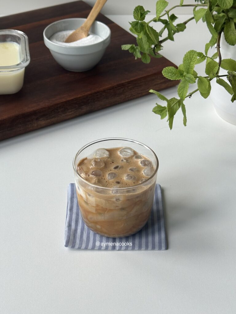 sweetened coffee poured over milk for an iced creme brulee latte