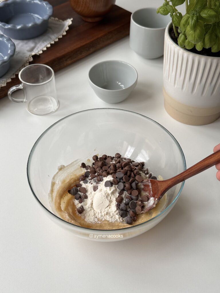 Flour, baking soda, salt and chocolate chips added to the cookie pie mixture.