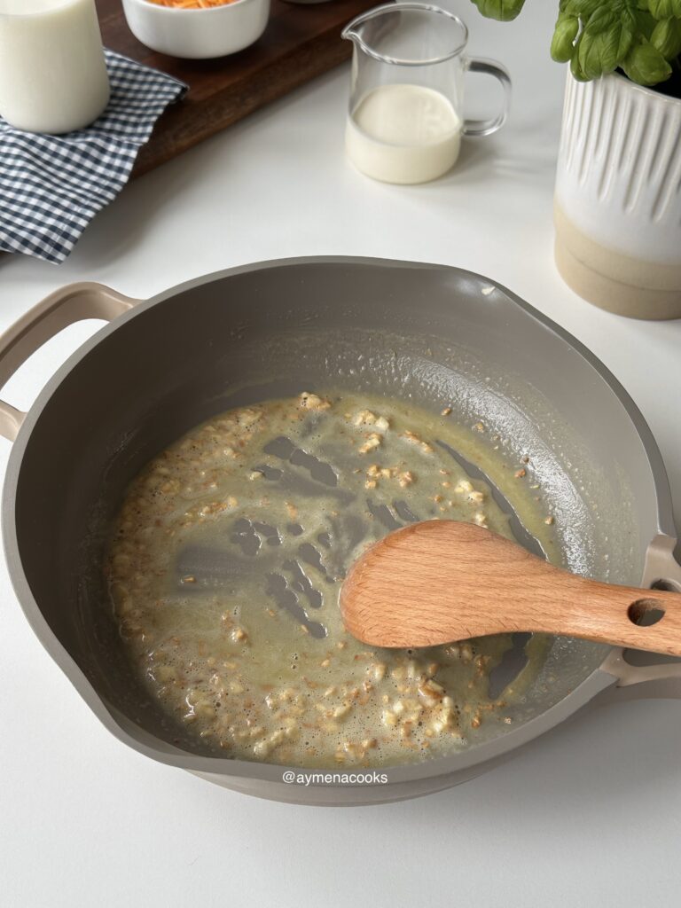 Plain flour stirred into garlic butter to make a roux for cheese sauce.