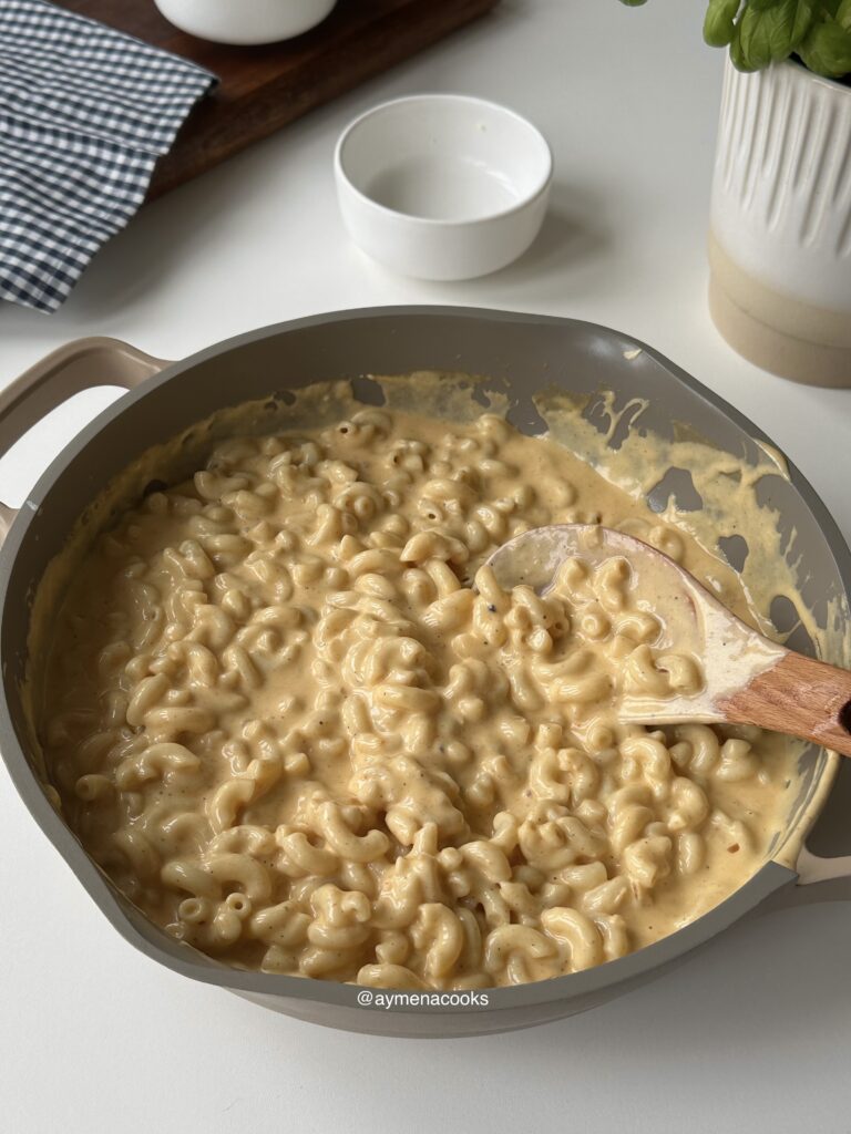Cooked macaroni coated in the creamy three-cheese sauce.