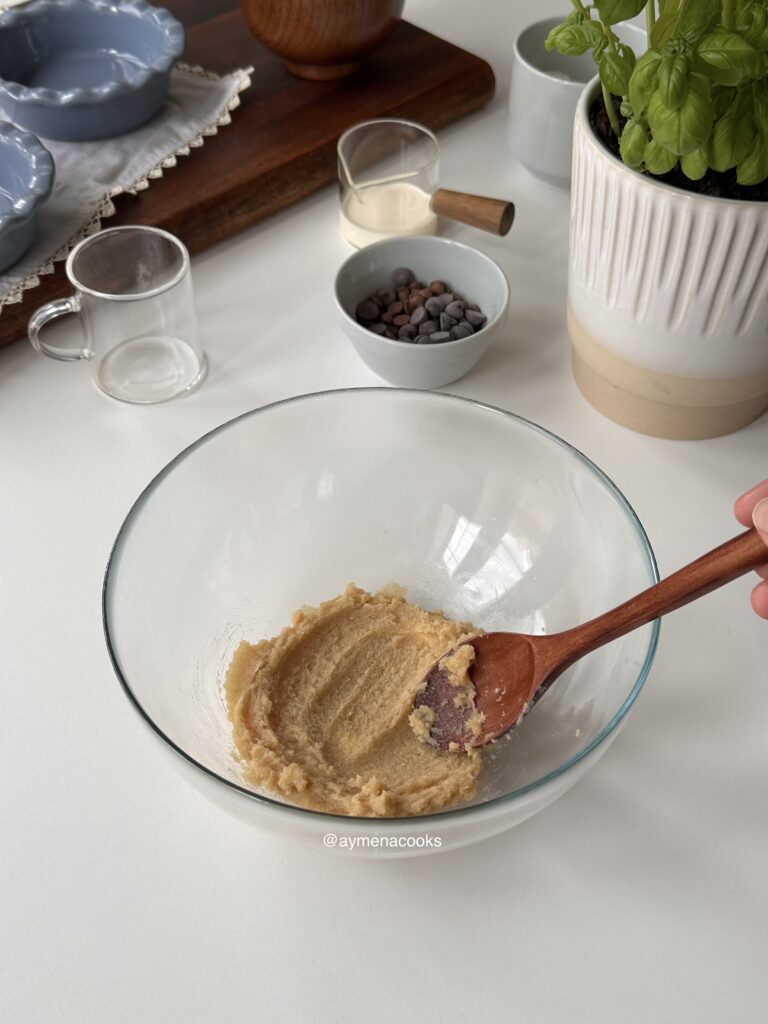 Softened butter and sugars creamed together for mini cookie pies.