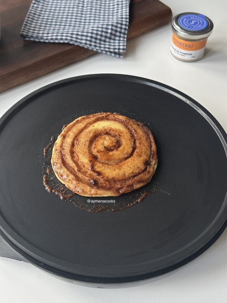 Cinnamon roll pancake with a caramelized brown sugar cinnamon swirl.
