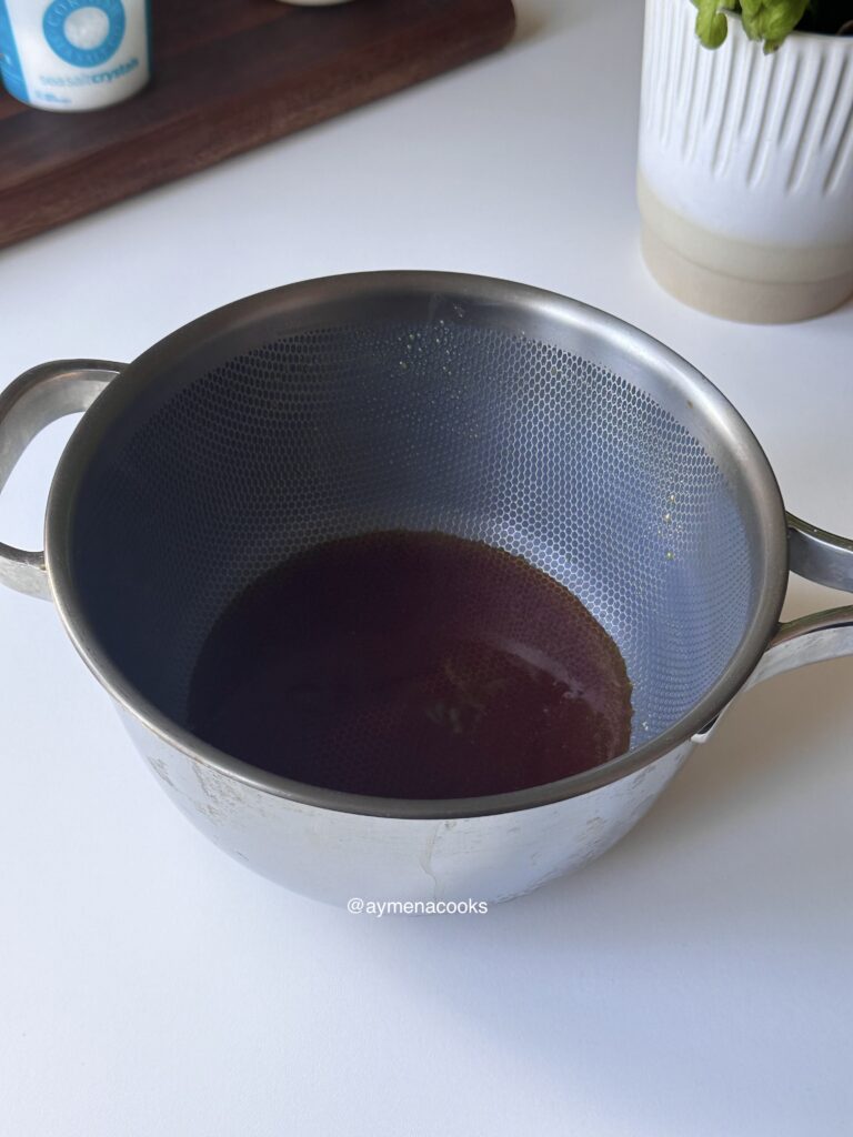 Deep golden-amber melted sugar ready for butter and cream.