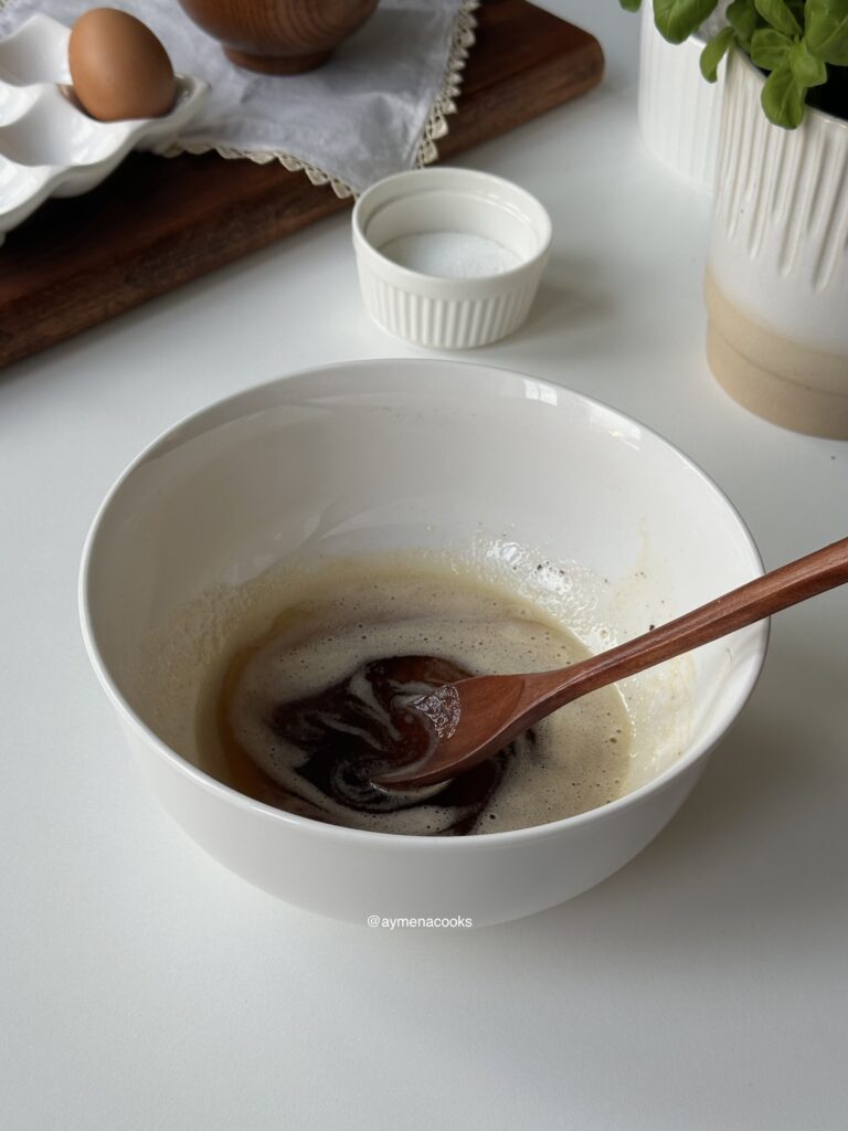 Browned butter left to cool in a heatproof mixing bowl.