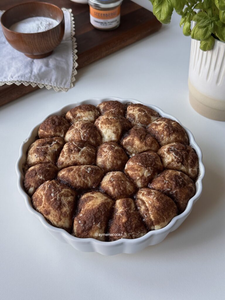 Golden baked cinnamon roll bites with caramelized cinnamon topping.
