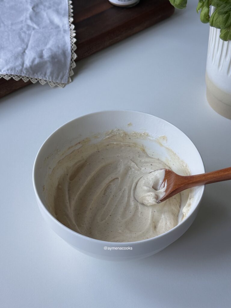 Smooth brown butter cream cheese frosting in a mixing bowl.