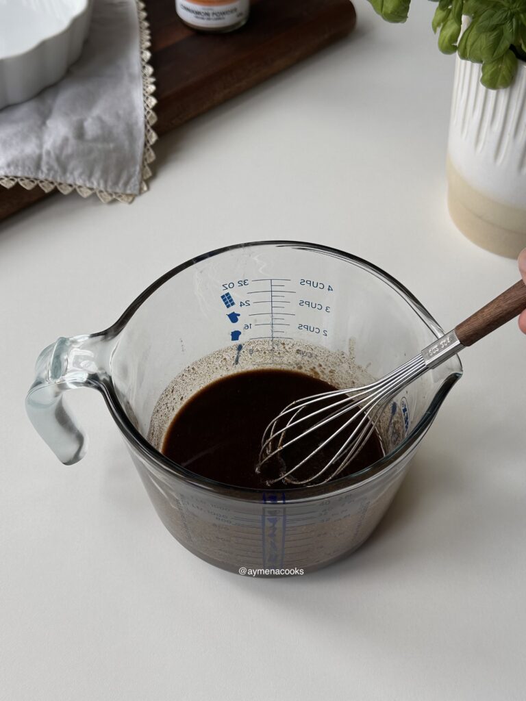 Melted butter, dark brown sugar and cinnamon mixed for cinnamon roll bites.