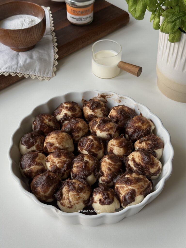 Cinnamon roll bites visibly puffed after the second rise.