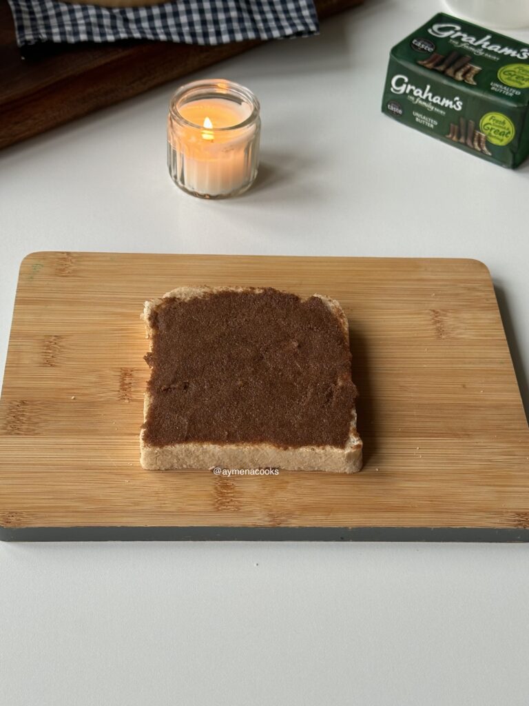 Brown sugar cinnamon filling spread over sliced bread for French toast sandwiches.