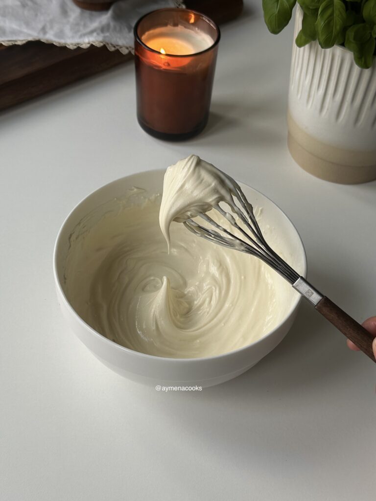 Smooth mascarpone frosting whipped to medium peaks.